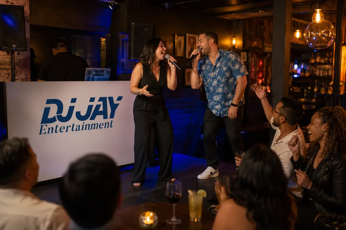 A man and woman singing karaoke beside a professional DJ booth